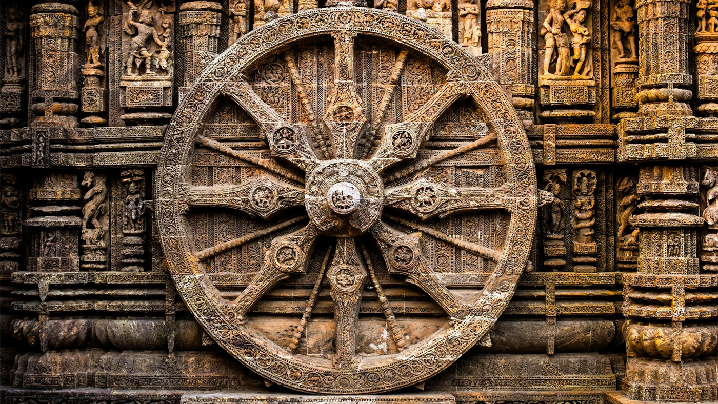 Intricate carvings on the stone wheel at Konark